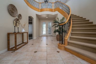 Experience the quality and elegance from the spiral staircase, towering ceilings and luxury flooring. | Image 2