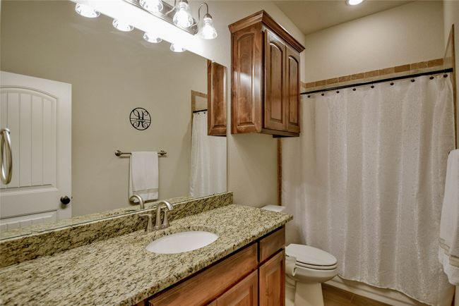 Guest Bathroom with toilet, vanity, a shower with shower curtain, and recessed lighting | Image 23