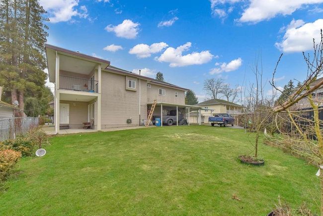 Rear view of property featuring a balcony | Image 8
