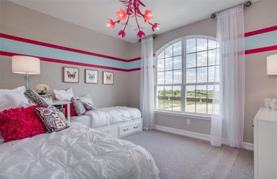 Bright secondary bedroom *Photos of furnished model. Not actual home. Representative of floor plan. Some options and features may vary | Image 2