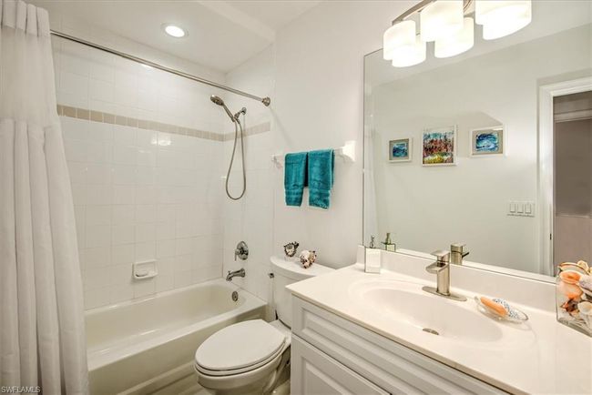 Bathroom with recessed lighting, toilet, vanity, and shower / bath combo with shower curtain | Image 18