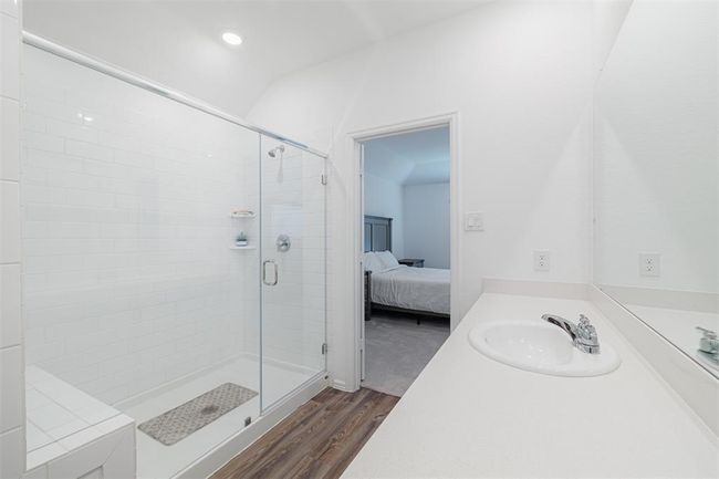 The ensuite bath with an oversized walk-in shower and generous closet. | Image 11