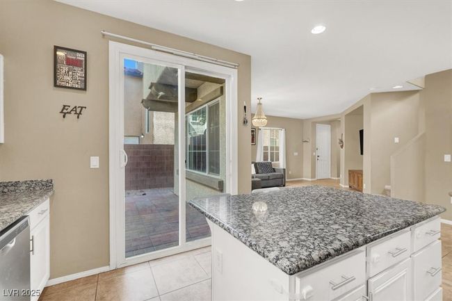 Kitchen with dishwasher, baseboards, dark stone counters, white cabinets, and recessed lighting | Image 10