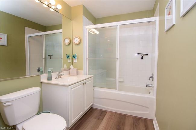 Second bath features tub and shower and is adjacent to the guest quarters. | Image 24