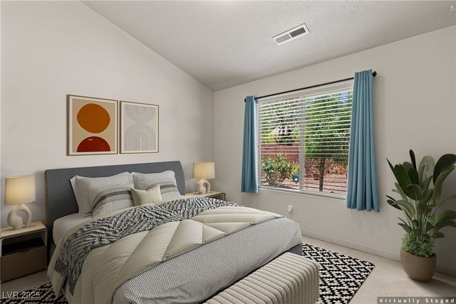 Bedroom with carpet floors and vaulted ceiling | Image 30