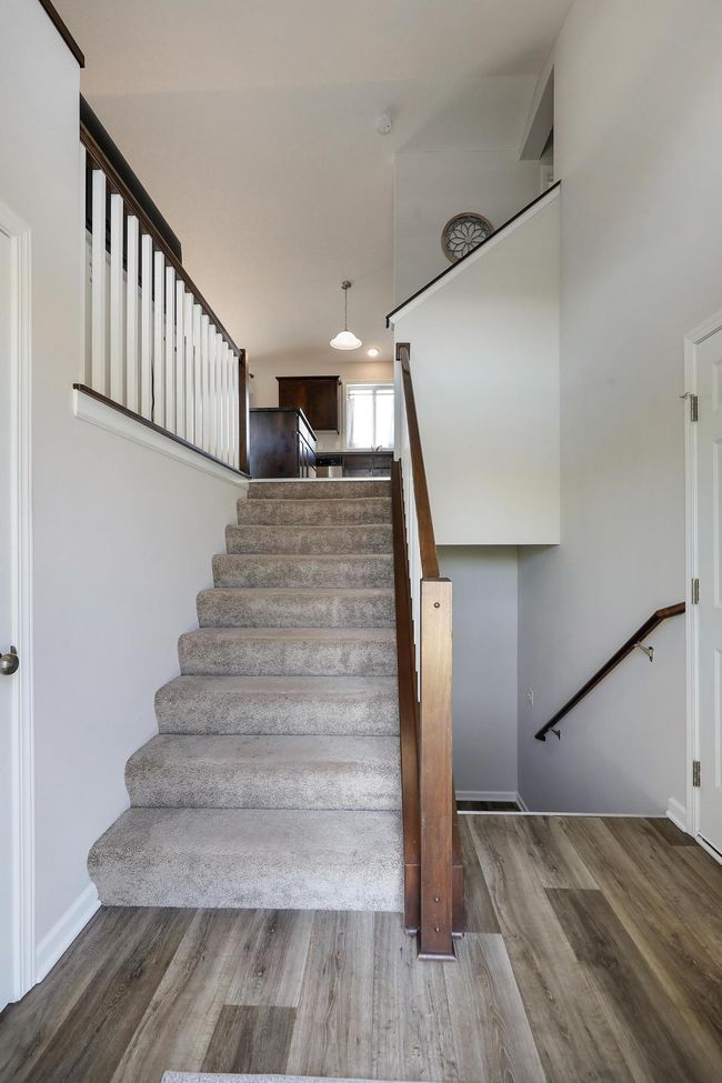 Head upstairs to discover a beautifully maintained, like-new living space-thoughtfully designed for comfort, style and functionality. | Image 6