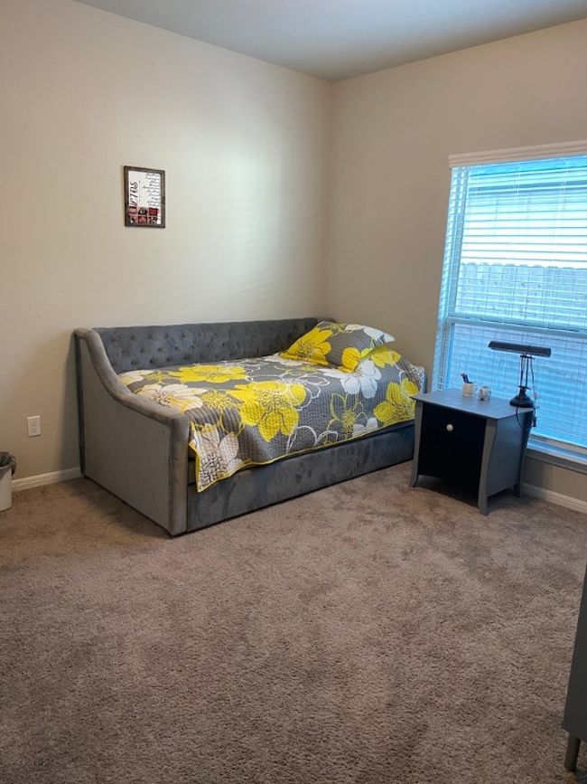 Carpeted bedroom featuring baseboards | Image 10