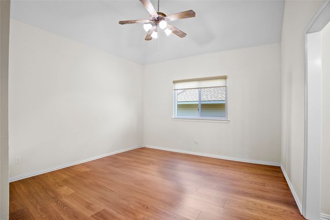 Unfurnished room with light wood-style flooring and ceiling fan | Image 25