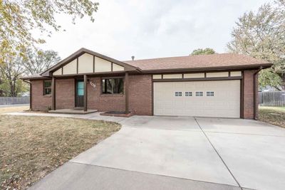 View of front facade featuring a garage | Image 2