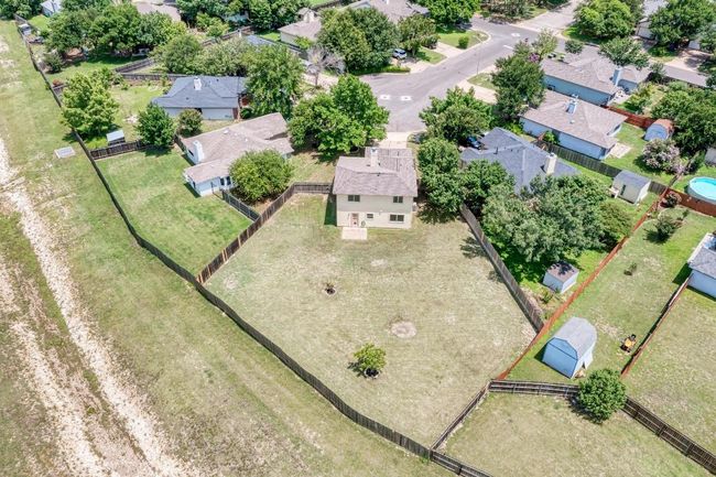 Ariel view of home and greenspace behind | Image 25