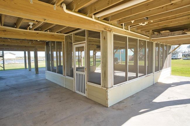 Stay away from the mosquitos in this screened porch. | Image 9