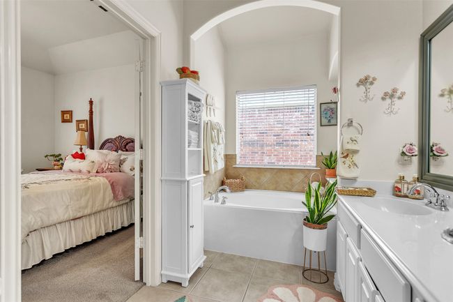 Bathroom with a garden tub, tile patterned flooring, vanity, and ensuite bathroom | Image 25