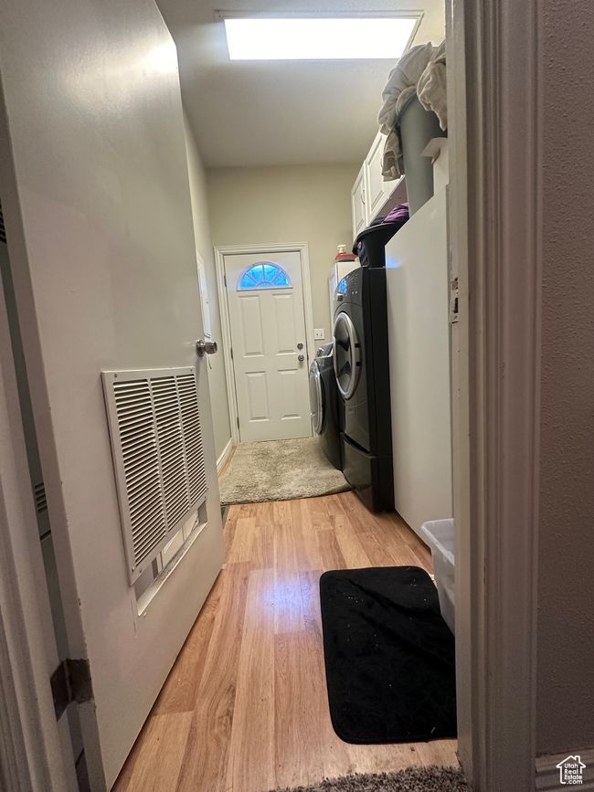 Carpeted bedroom with baseboards and lofted ceiling | Image 14