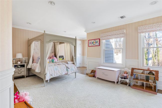 Bedroom with wallpapered walls and multiple windows | Image 33