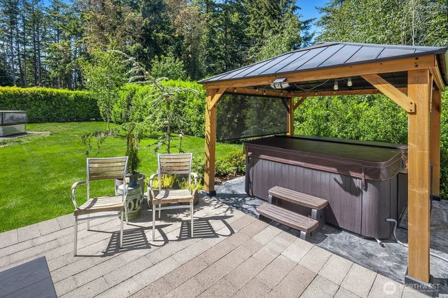This sanctuary includes the hot tub and pergola for ultimate relaxation. | Image 31