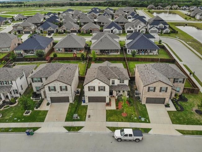 Aerial perspective of suburban area with a large body of water | Image 20