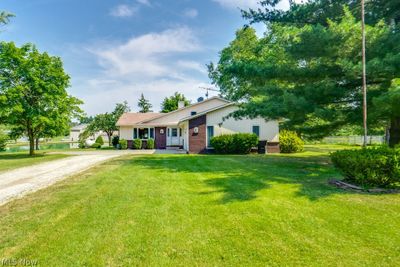 Ranch-style home with a front lawn | Image 3