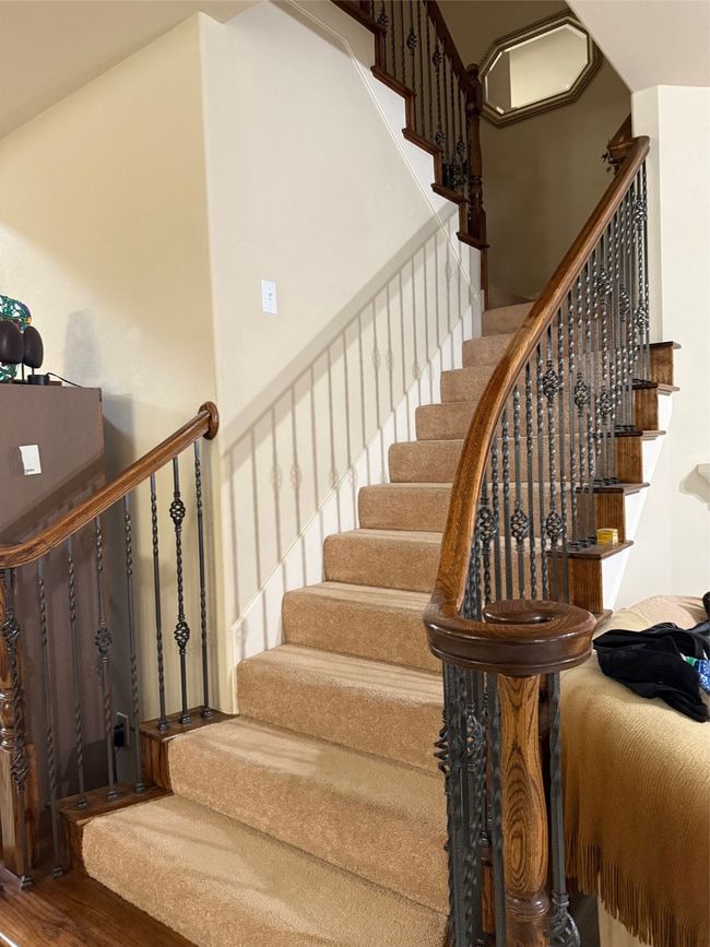 Stairway featuring wood finished floors | Image 26