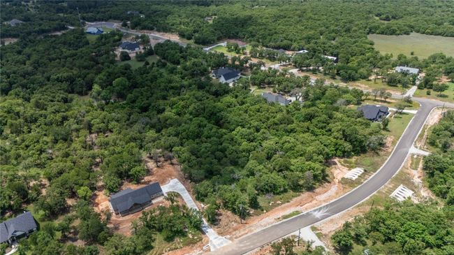 Aerial overview of property's location featuring a forest | Image 7