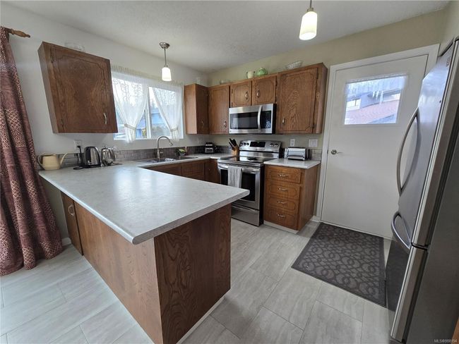 7071 Mc Dougal Pl, House other with 4 bedrooms, 3 bathrooms and 2 parking in Port Hardy BC | Image 9