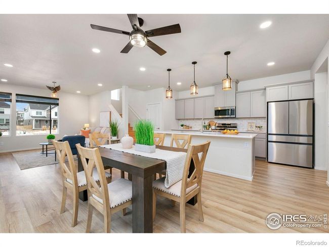Dining Area into Kitchen and Living Room | Image 6