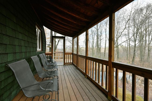 The guesthouse screened-in porch. | Image 66