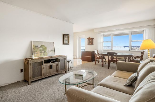 Spacious living room featuring river views | Image 4