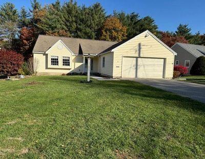 in back yard. Nicely landscaped while being easy to maintain. A KOKKO built custom home. One owner that has pride in their home. FHA propane heat, central air conditioning, Ranai hot water heater, and heat pump for those chilly days to keep cost down. | Image 1