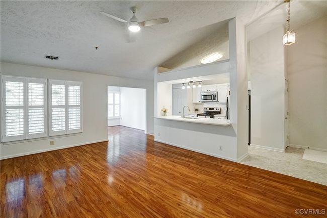 Huge Great Room with LVP Flooring and Cathedral Ceiling! | Image 9