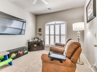 Carpeted office, 4th bedroom, featuring ceiling fan and plenty of natural light | Image 3