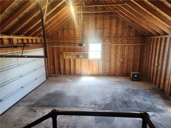 Garage has a newer door, front and back yard man doors and entry to the basement and kitchen. Incredibly well thought out. | Image 21