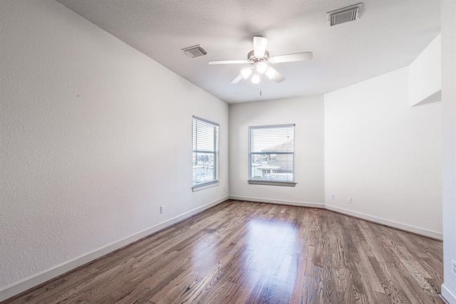 Third bedroom with same stunning wood floor. Enjoy views of the water. | Image 38