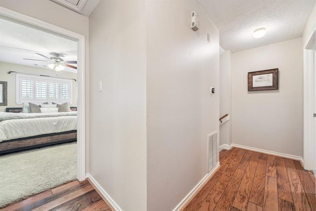 Hardwood floors extend through the upstairs hallway accommodating traffic easily. | Image 22