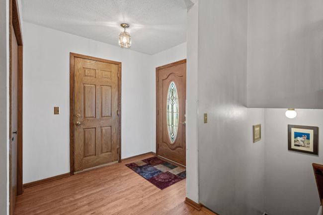 Walk inside to this large foyer with a convenient closet to deposit jackets and shoes. | Image 4