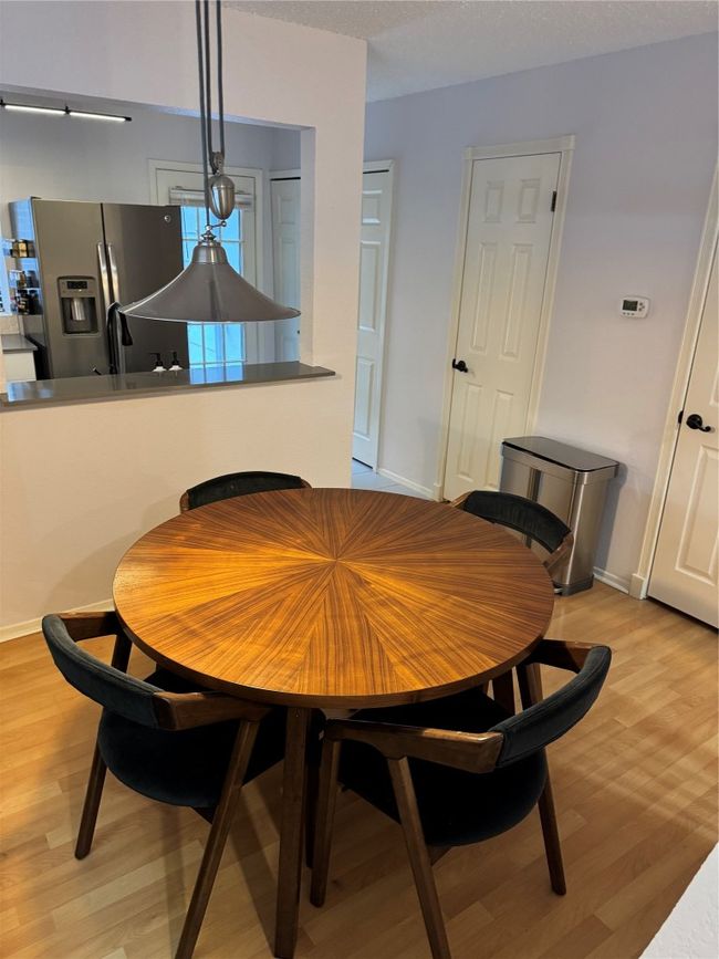 Dining room featuring light wood-type flooring and baseboards | Image 8