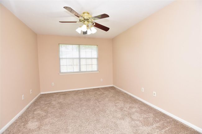 With its emphasis on functionality and comfort, this primary bedroom with an attached bonus room serves as a practical sanctuary, providing a restful environment and additional space to suit your lifestyle. | Image 15