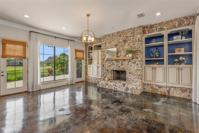 The den overlooks the pool area-great for watching the kiddos swim. | Image 6