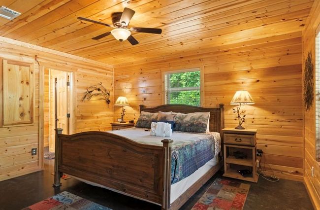 Bedroom featuring wood ceiling, wooden walls, and ceiling fan | Image 14