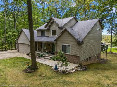 7111 Tucker Road, Home with 4 bedrooms, 3 bathrooms and null parking in Groveland Twp MI | Image 3