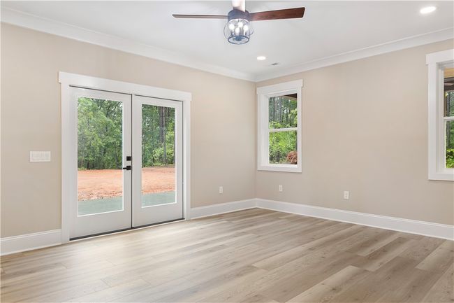 Master bedroom with exterior access to a patio. | Image 19