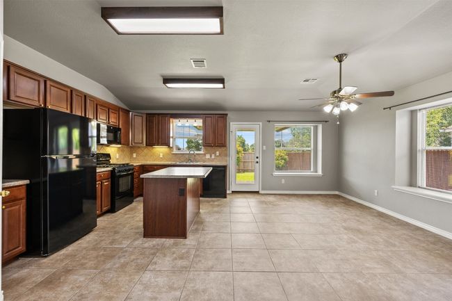Kitchen with huge dining area | Image 10