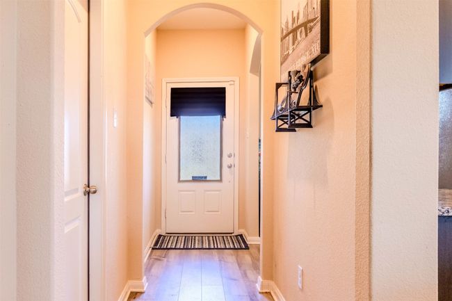 Doorway with wood-type flooring | Image 4