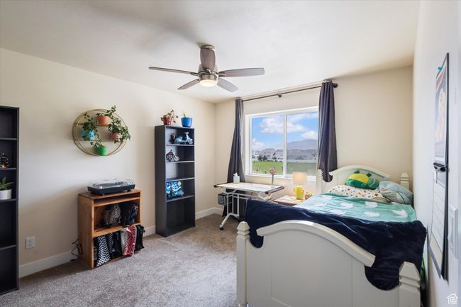2nd bedroom featuring carpet flooring and ceiling fan | Image 21