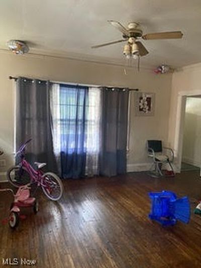 Miscellaneous room with hardwood / wood-style floors and ceiling fan | Image 2