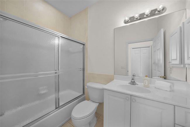 GUEST BATHROOM LOCATED ADJACENT TO THE GUEST ROOM AND FAMILY ROOM | Image 38