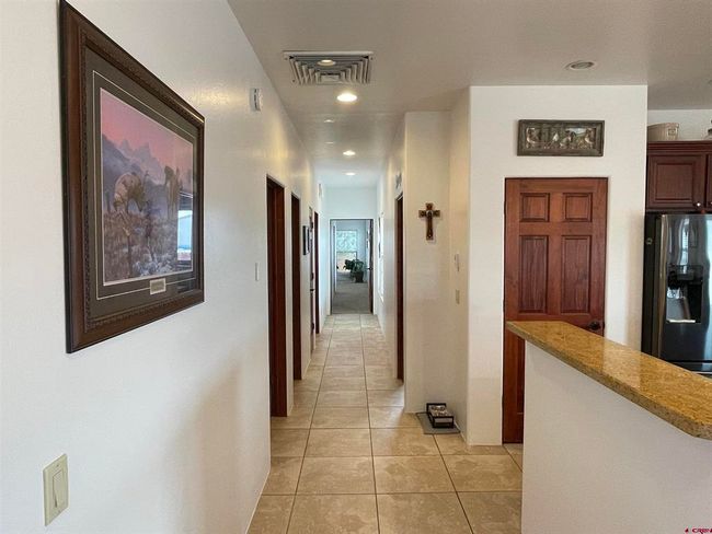 Hallway from entry way and kitchen | Image 9