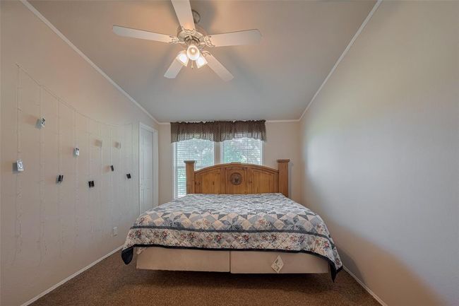 Enjoy the luxurious feel of polished tiles and modern plumbing fixtures. With plenty of storage in the cabinetry and soothing decor, this is the perfect oasis for relaxation. | Image 23