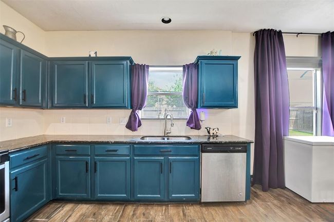 Vibrant and modern kitchen with bold color accents! | Image 21