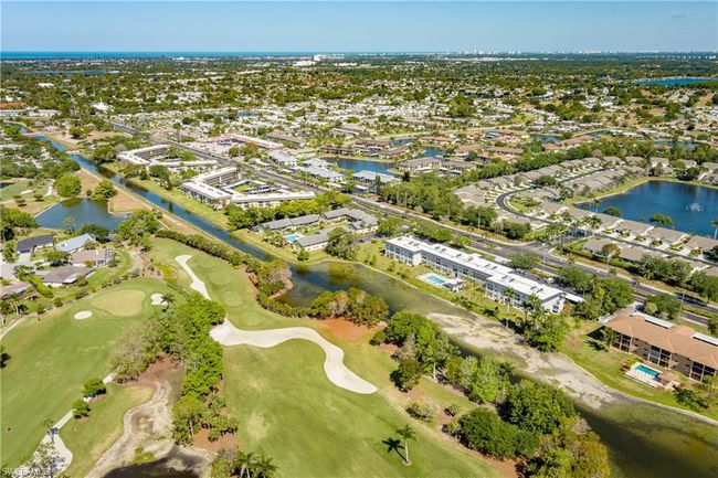 Birds eye view of property featuring a residential view, a water view, and view of golf course | Image 43