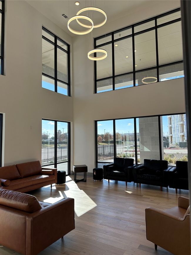 Lobby with a towering ceiling and a water view | Image 12
